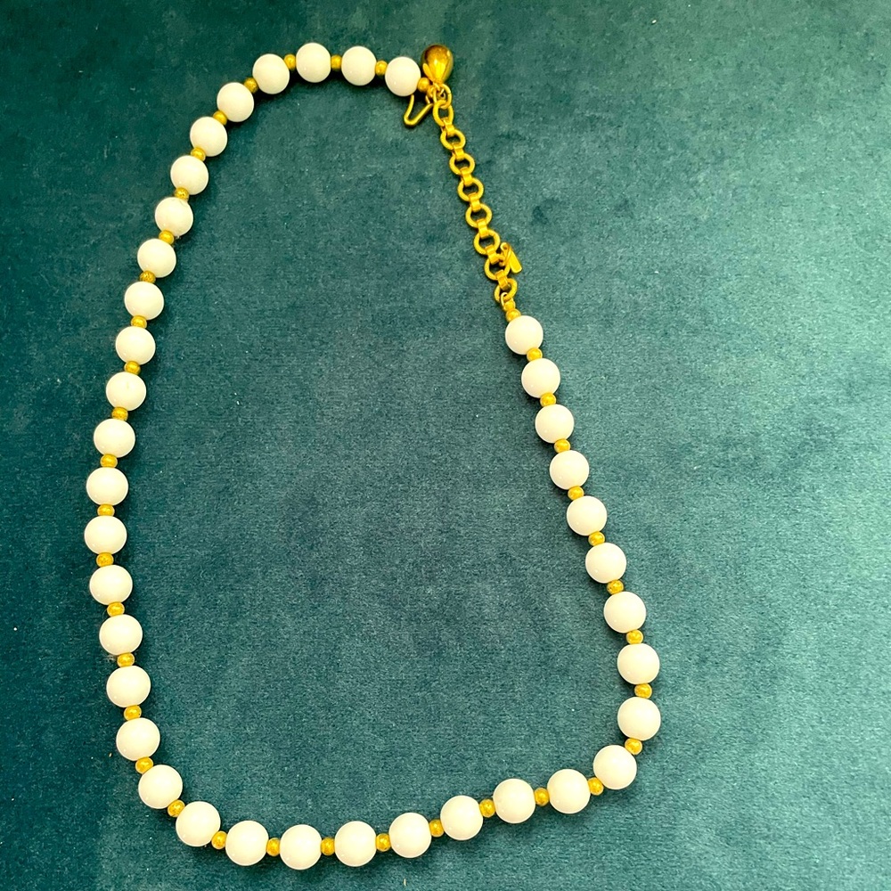 White beaded necklace with gold separators